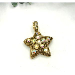 Pendant gold tone textured star shape AB crystals